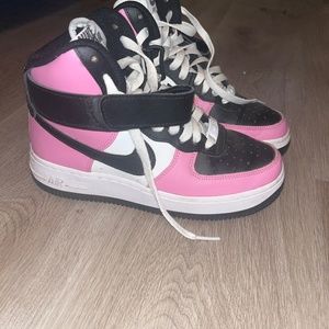 Pink and black high top Nikes